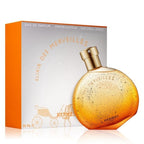 Hermes Elixir des Merveilles perfume bottle and packaging on a white background