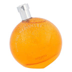 Orange perfume bottle with silver cap on a white background