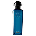 Blue cologne bottle with black cap on a white background