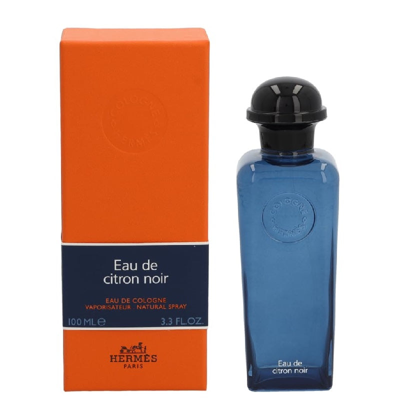 Blue perfume bottle with black cap and orange packaging featuring Hermes branding on a white background