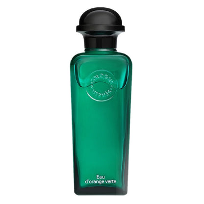 Green perfume bottle with black cap on a white background