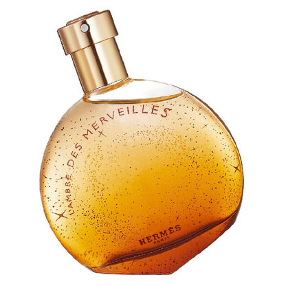 Hermes perfume bottle with gold cap on a white background