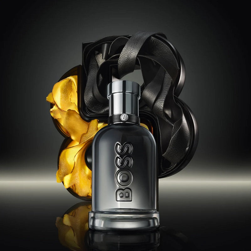 BOSS perfume bottle with a decorative background