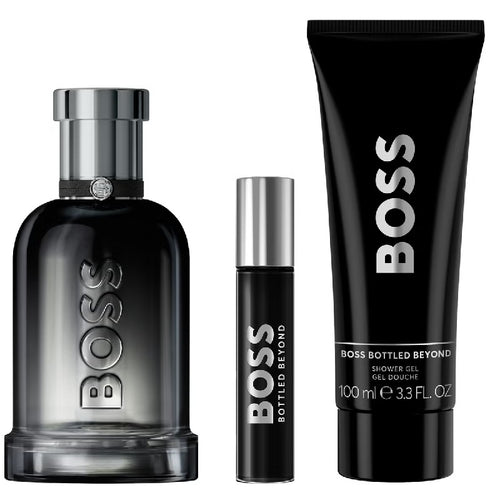 BOSS perfume set with a bottle, rollerball, and shower gel on a white background