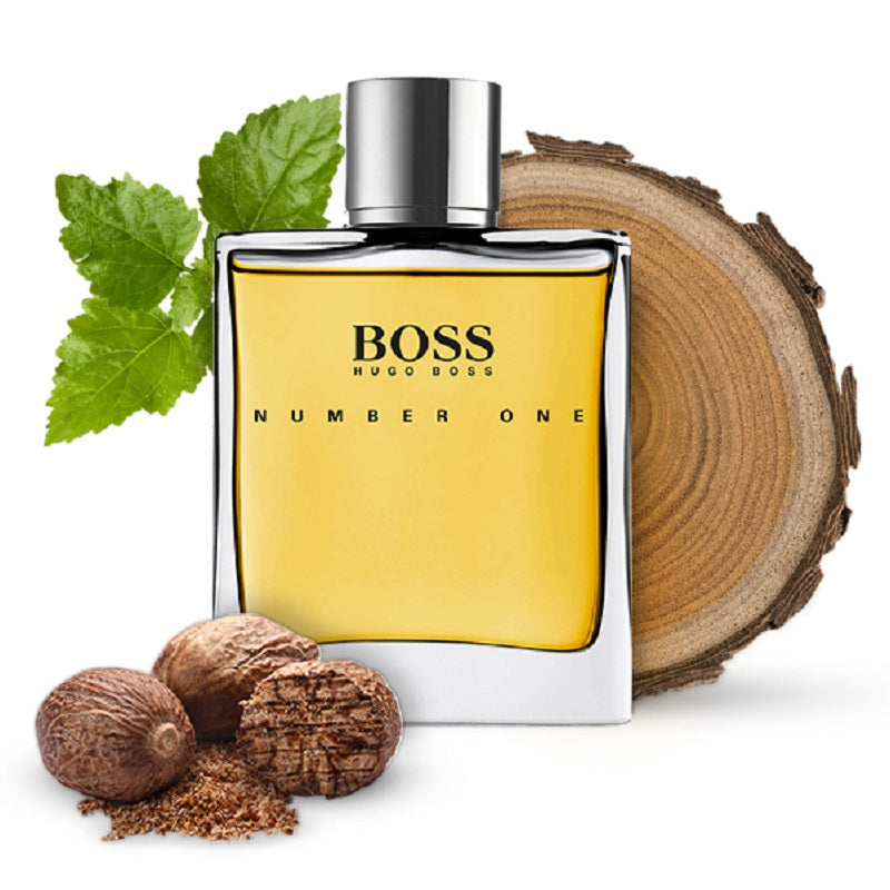 BOSS Number One perfume bottle with natural elements on a white background