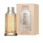 A product image featuring a 100ml bottle of 'Boss The scent Pure Accord' eau de toilette by Hugo Boss, with its packaging box.