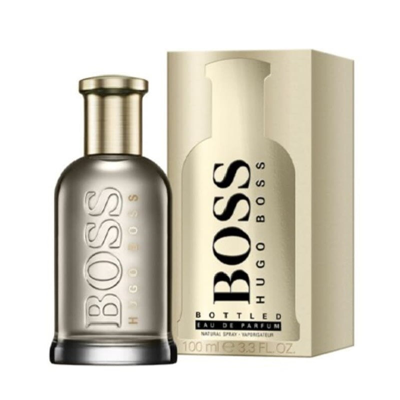 Hugo Boss Bottled Gold 100ml perfume bottle positioned beside its elegant matching gold box on white background.