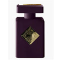 Purple perfume bottle with gold decorative emblem on a white background