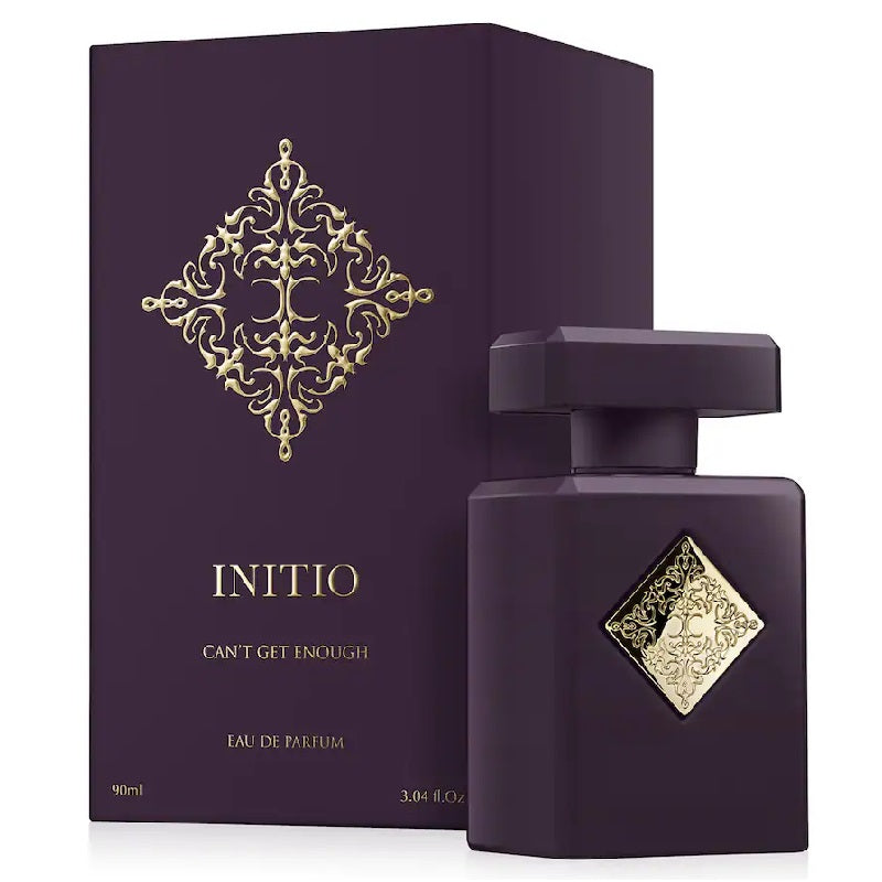 Purple Initio perfume bottle and packaging with gold decorative elements on a white background