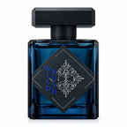 A deep blue Wild Rush bottle with a black cap and a black diamond label bearing silver ornament and blue Wild Rush lettering.