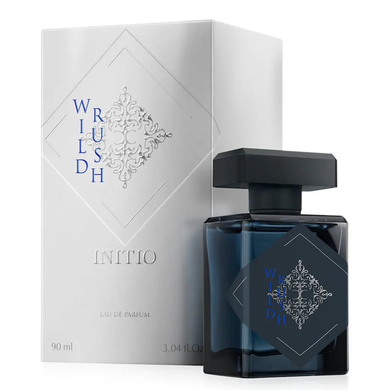 Initio Wild Rush 90ml Eau de Parfum bottle beside its white presentation box with an embossed Wild Rush design.