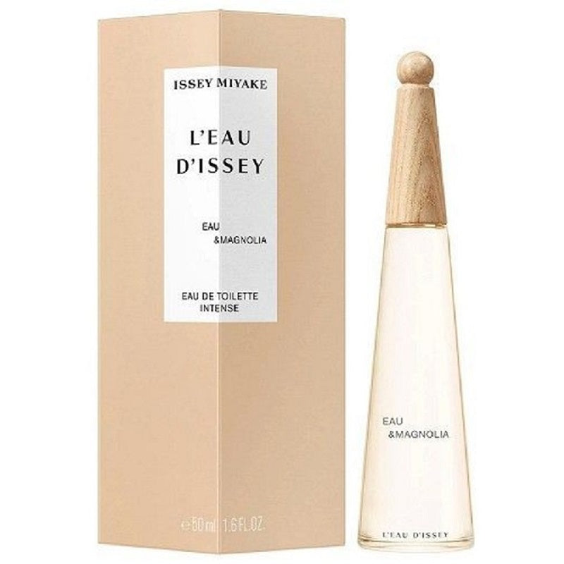 A clear L'Eau d'Issey Eau & Magnolia bottle beside its beige box labelled Eau de Toilette Intense 50ml, on a white background.