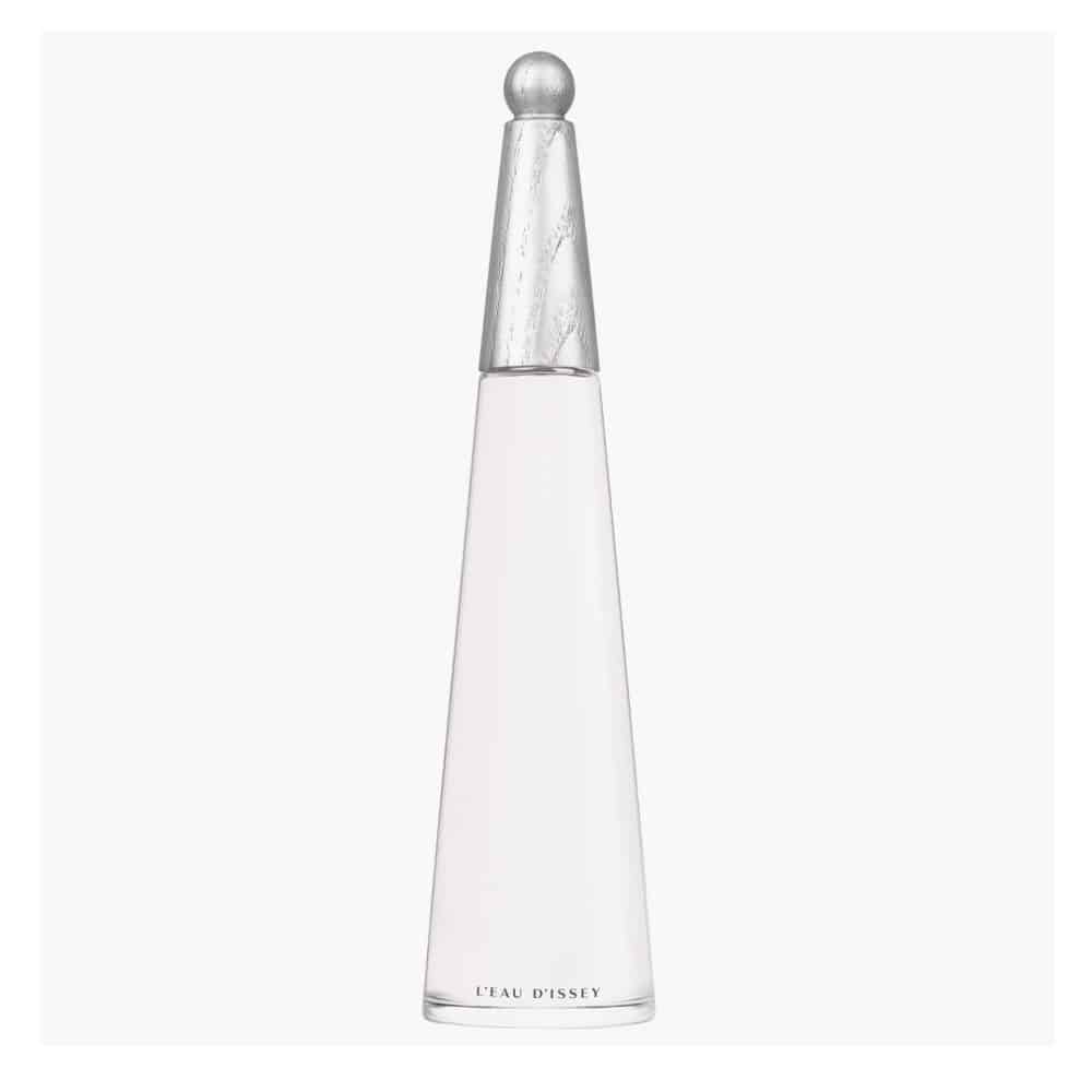 A tall, slender bottle of Disney Eau de Parfum with a silver metallic cap and a pale pink liquid inside a clear glass bottle, set against a light gray background.