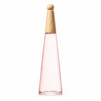 A pink conical bottle of L'Eau d'Issey Pivoine Intense by Issey Miyake with a light wooden cap on a white background.