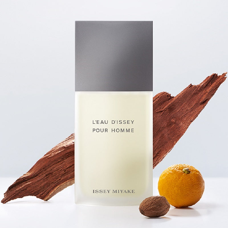 Issey Miyake L'EAU D'ISSEY POUR HOMME perfume bottle with natural elements on a light background