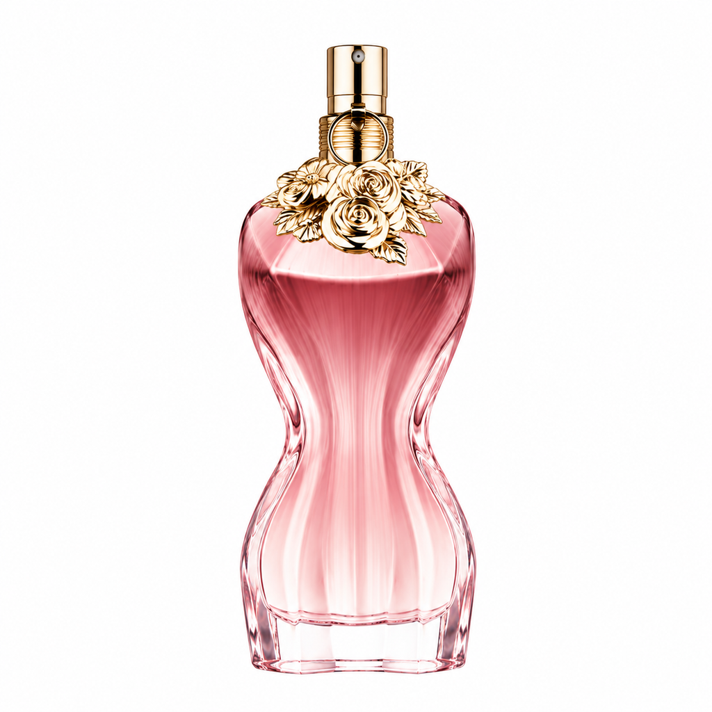 A pink perfume bottle with a flared base, ribbed textured body, and a gold-tone cap decorated with sculpted roses, shown on a plain white background.