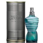 A product image featuring a striped blue and white bottle of Jean Paul Gaultier 'Le Male' Eau de Toilette next to its cylindrical metal packaging.