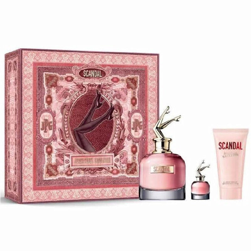Gift set of Scandal Woman Eau de Parfum by Jean Paul Gaultier, including a 80ml bottle of EDP, a smaller bottle, and a perfumed body lotion in packaging with intricate red and white designs.