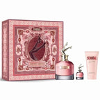 Gift set of Scandal Woman Eau de Parfum by Jean Paul Gaultier, including a 80ml bottle of EDP, a smaller bottle, and a perfumed body lotion in packaging with intricate red and white designs.