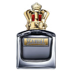 A square-shaped perfume bottle with a prominent golden cap resembling a crown, labeled 'SCANDAL'.
