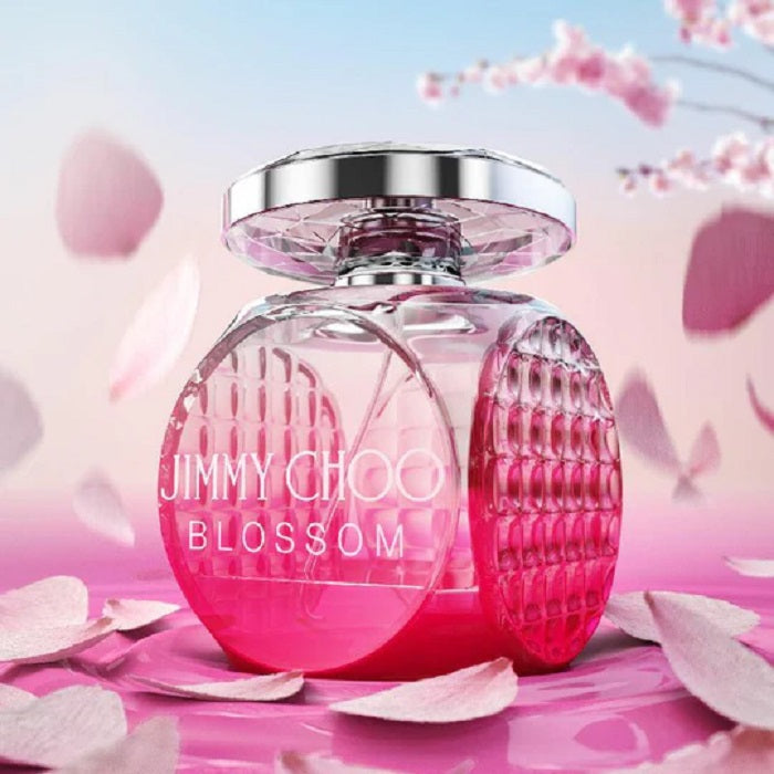 Pink perfume bottle with 'Jimmy Choo Blossom' text on a background of pink petals.