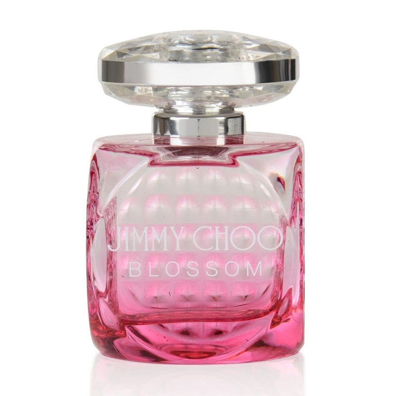 A pink glass bottle of Jimmy Choo Blossom Eau de Parfum with a silver cap.