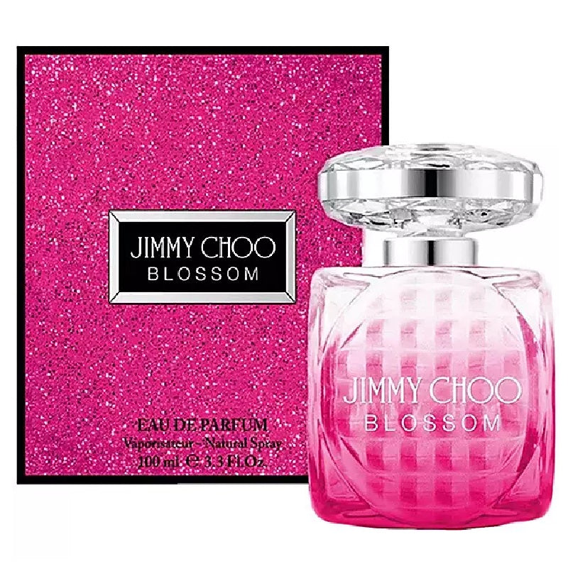 Pink perfume bottle and packaging on a white background