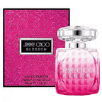 Pink perfume bottle and packaging on a white background