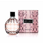 Jimmy Choo Women's Eau de Parfum bottle and packaging, featuring a pink snake skin pattern on the box with a clear, geometric designed bottle displaying the perfume.