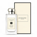 Jo Malone London Wood Sage & Sea Salt Cologne in a clear glass bottle with a silver cap, shown next to its cream-colored packaging box.