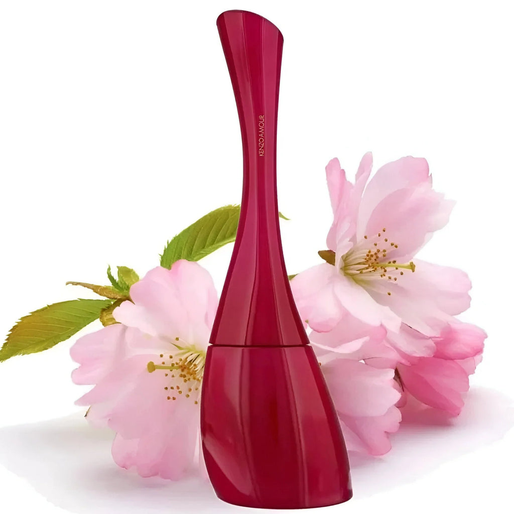Red perfume bottle with cherry blossoms on a white background