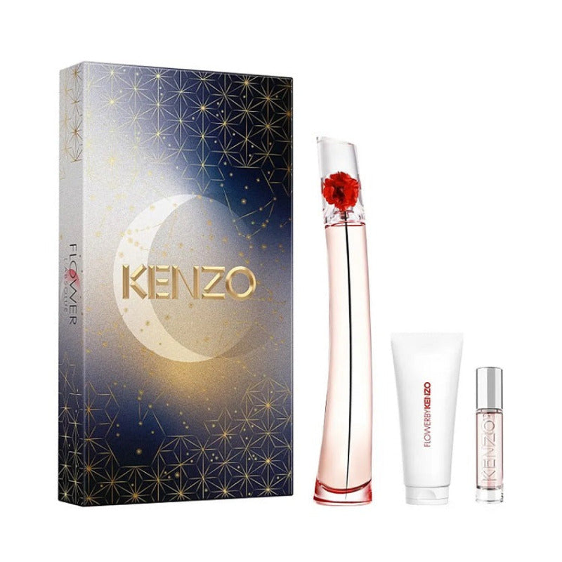 Kenzo Flower L'Absolu 100ml (3pc-Set) Eau de Parfum by Kenzo, displayed with a 100ml perfume bottle, a 10ml perfume spray, and a 75ml scented body lotion, all presented in front of a gift box with stars and moon design.