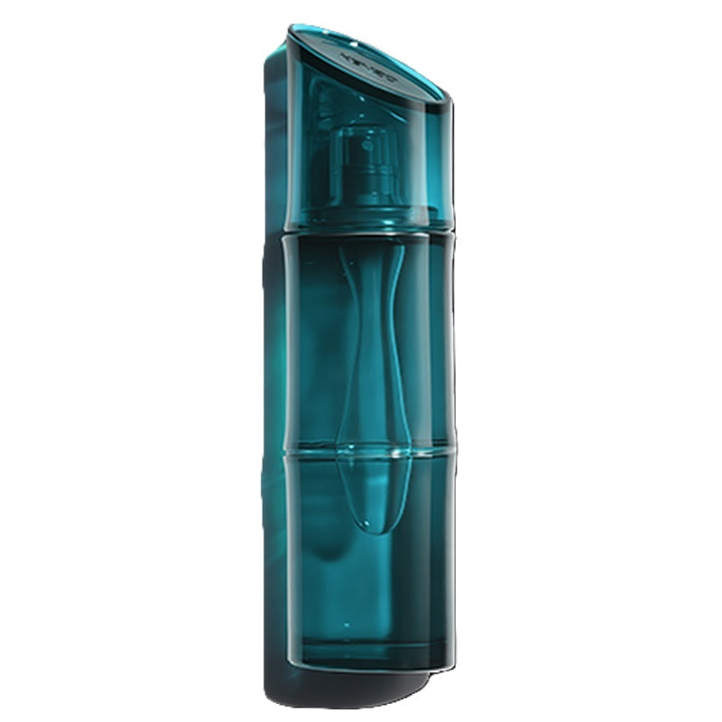 Kenzo Homme Eau de Toilette in a translucent deep teal, bamboo-inspired bottle with a slanted matching cap, against a white background.