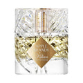 Clear glass bottle of Apple Brandy by Kilian with gold label on a white background