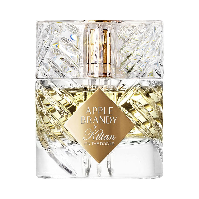 Clear glass bottle of Apple Brandy by Kilian with gold label on a white background