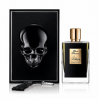 A perfume bottle and its matching presentation box on a white background. The box features a glossy black skull design, and the bottle has a black body with a gold cap and a gold label reading 'Black Phantom by Khan'.