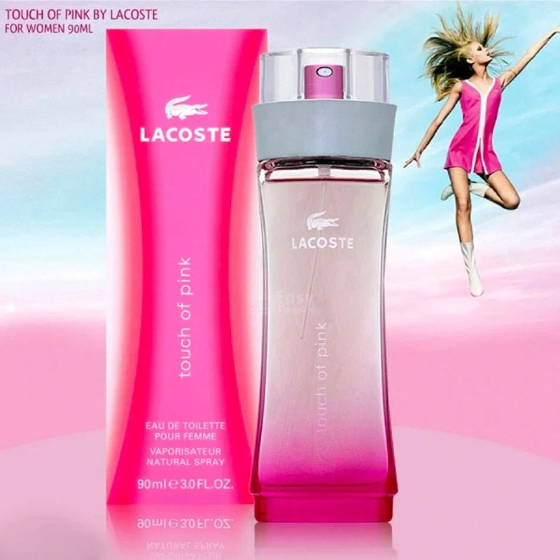 Lacoste Touch of Pink perfume bottles with a model in a pink dress on a colorful background