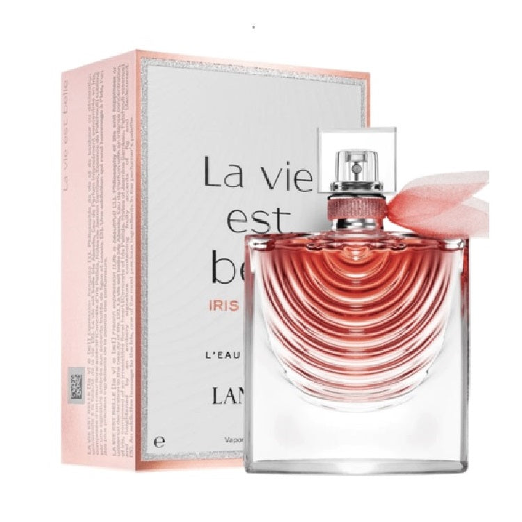 Perfume bottle with pink packaging and 'La Vie Est Belle' text on a white background