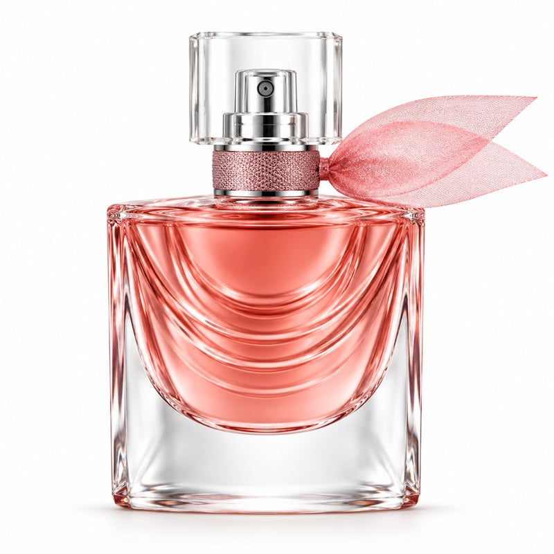 Lancôme La Vie Est Belle Iris Absolu perfume bottle with pink fragrance, curved glass ridges, a clear cap and pink ribbon on a white background.