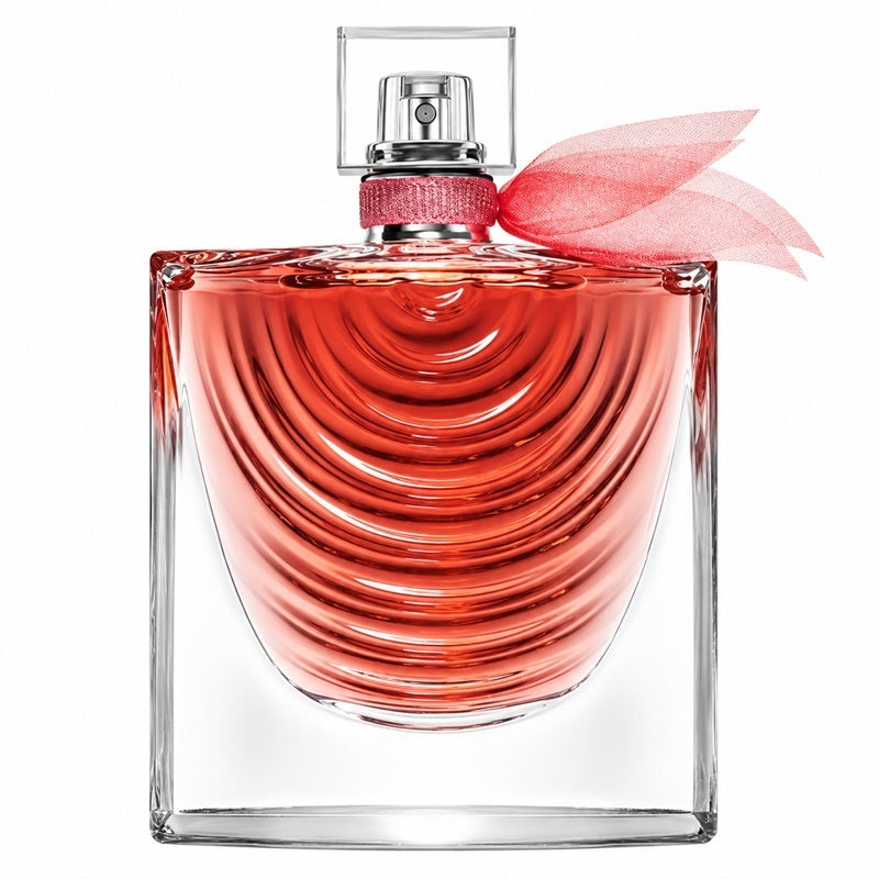 Bottle: Lancôme La Vie Est Belle Iris Absolu perfume bottle with curved glass ridges, pink fragrance, a clear cap and pink ribbon.
