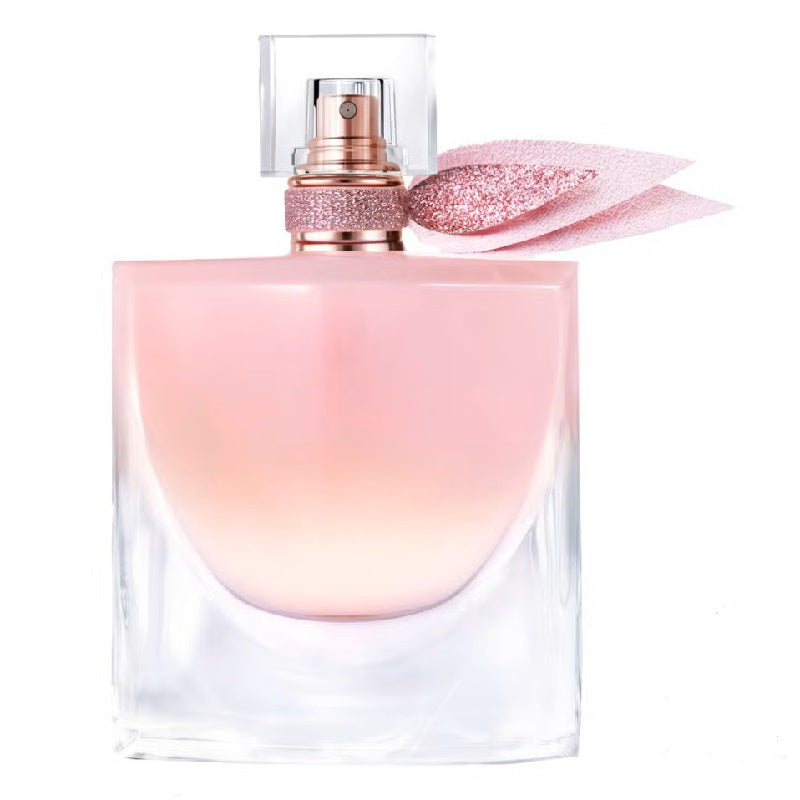 Pink and clear perfume bottle with a decorative cap on a white background