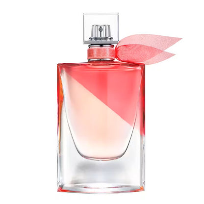 Perfume bottle with a pink flower on a white background