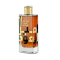 Perfume bottle with gold cap and Arabic text on a white background