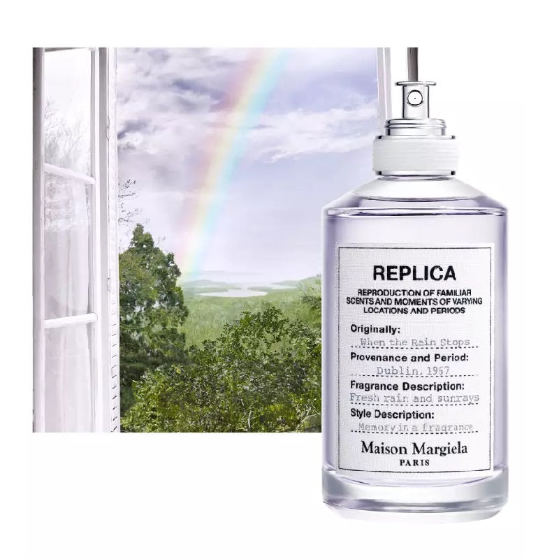 Maison Margiela replica perfume bottle with a scenic background of trees and a rainbow.