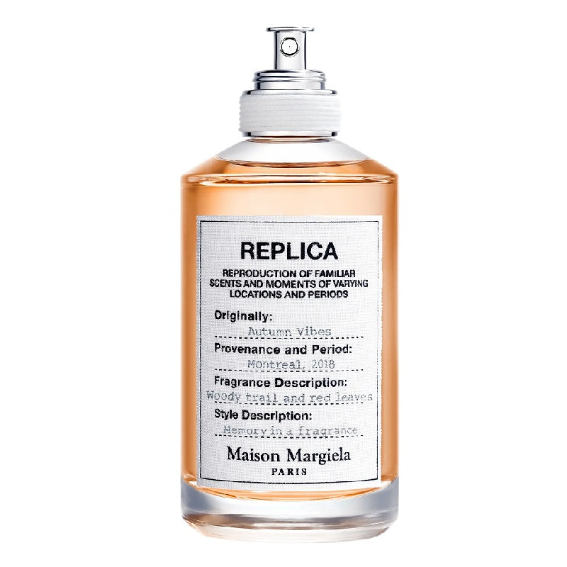 A bottle of Maison Margiela Autumn Vibes Eau de Toilette with a spray nozzle, labeled with the product information.
