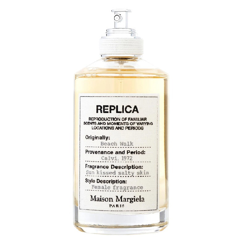 A bottle of Maison Margiela Beach Walk Eau de Toilette with the label detailing the fragrance description and notes.