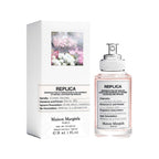Maison Margiela perfume bottle and its packaging box on a white background.