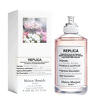 Maison Margiela, Flower Market bottle and its packaging box on a white background.