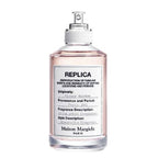 Perfume bottle with white cap and clear body on a white background