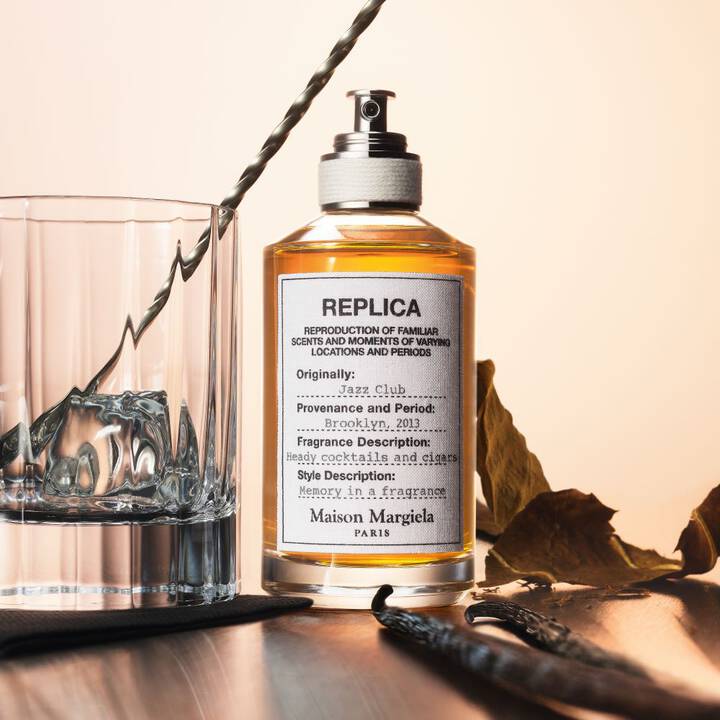 Maison Margiela replica fragrance bottle with decorative elements on a wooden surface